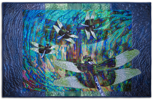 ART QUILT TITLED: Dragon Dance, CREATED by Karen Hampton, SIZE: 35 1/2” x 22 3/4” These luminescent digital/quilted pieces are a collaboration of husband and wife. Original photos digitally printed on satin polyester fabric with cotton batting. Quilted with silk thread.